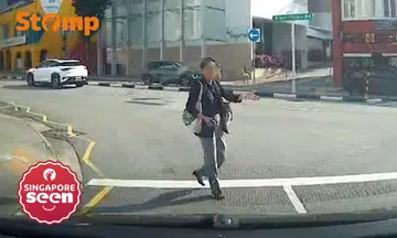 ‘Self-entitled’ pedestrian gestures as if she has right of way at River Valley Road