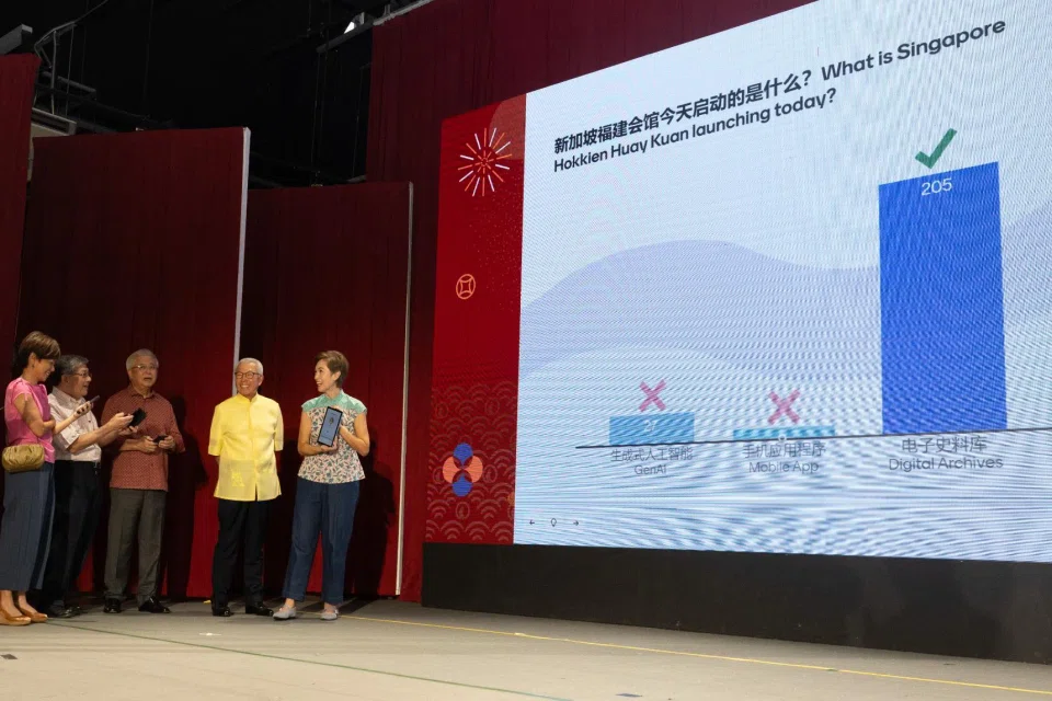 Digital Development and Information Minister Josephine Teo (right) at the launch of Singapore Hokkien Huay Kuan's digital database on Feb 15.