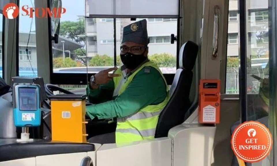 Tower Transit N. 167 bus captain wearing traditional tanjak