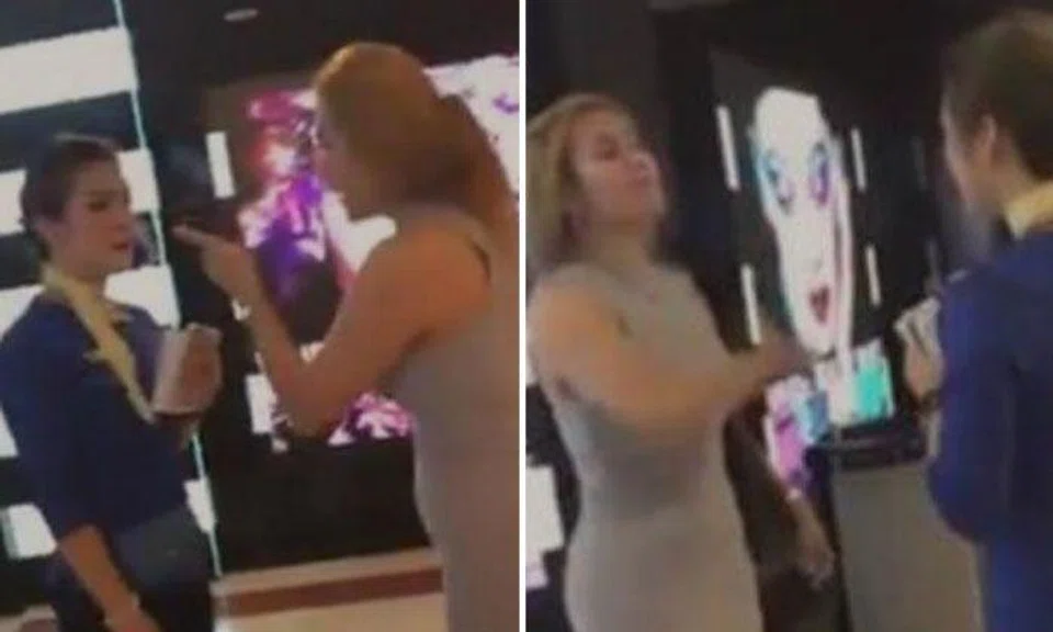 Woman pulls salesgirl out of store at Malaysia's KLCC shopping mall and slaps her repeatedly