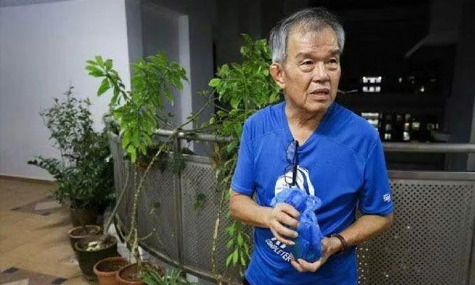 Guo Fangyuan continued placing items along the common corridor at his block despite being issued a court order. FILE PHOTO