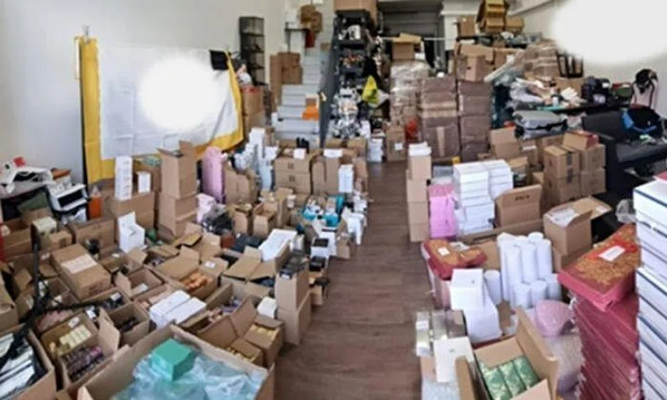 More than 13,000 items of purported trademark-infringing bottles of perfume, cosmetics, and household items with an estimated street value of more than $490,000 were seized. Police: Singapore Police Force