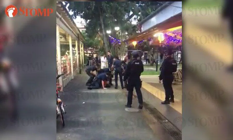 Man, allegedly high on drugs, tackled by police after wielding chopper at Eunos Crescent Market