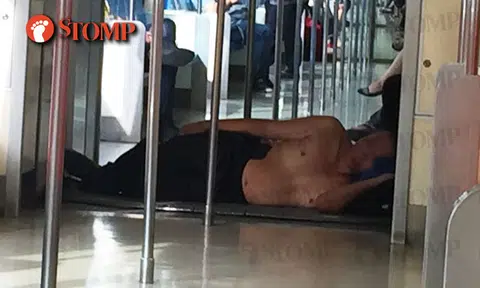 The weather's clearly too hot for uncle who lay topless in MRT train