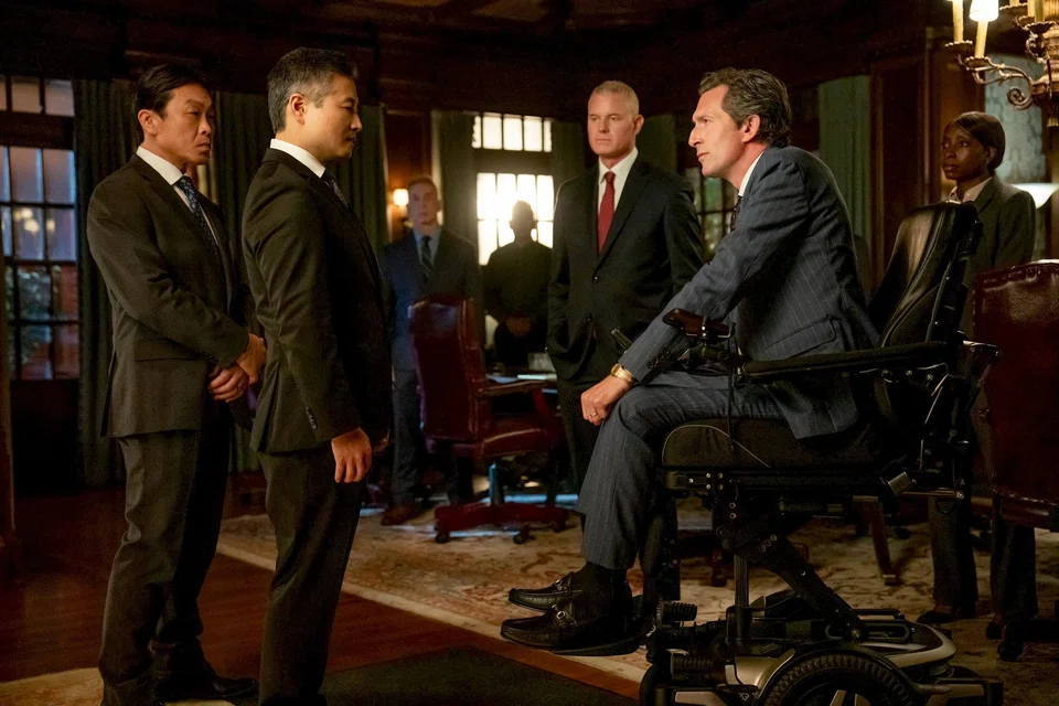 Fictional representatives of the Singapore Government (left) depicted in a scene from the Aug 20 episode of US crime drama series Countdown.