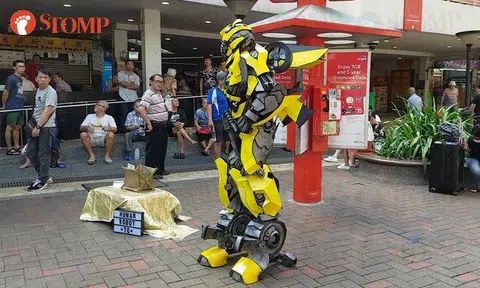 Transformer's iconic Bumblebee poses with fans at People's Park Complex