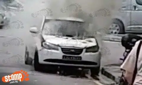 Thick smoke billows from burning car at Woodlands Drive 16