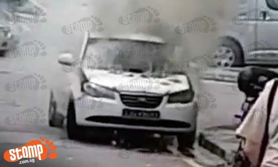 Thick smoke billows from burning car at Woodlands Drive 16