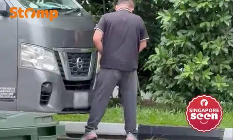 man peeing outside woodlands industrial building