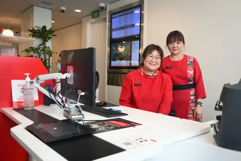 Ms Karen Teo (left), a bank officer from DBS South Bridge branch, and her supervisor, Ms Low Bee Peng, spent over an hour convincing the woman she had been scammed.