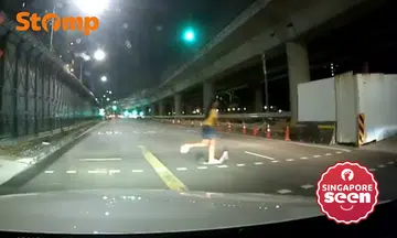 Driver alarmed by girl riding scooter across road during red light in Tanah Merah