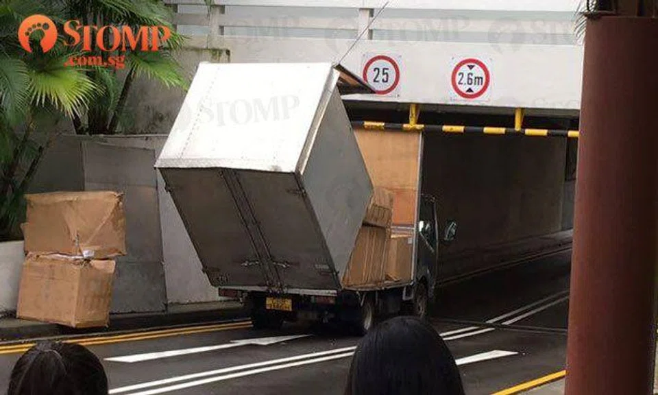 Oops! Lorry driver should have checked height limit before driving through building at NTU