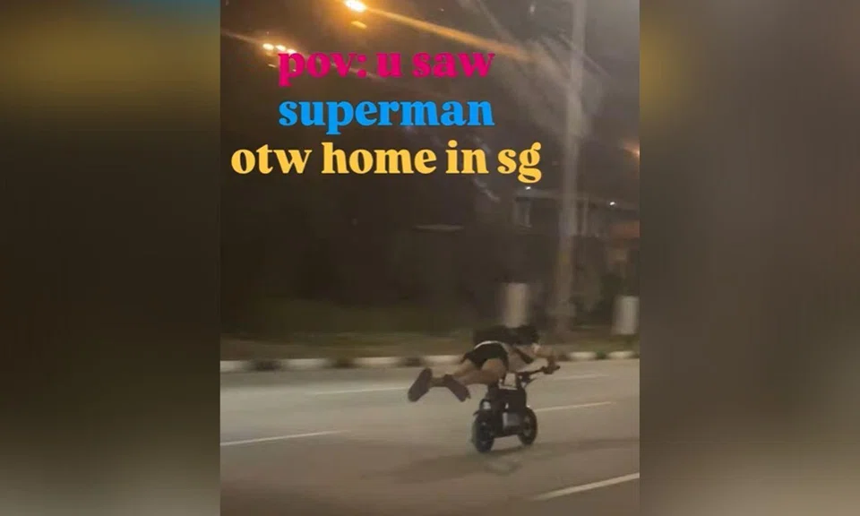 Man riding PMD down the road
