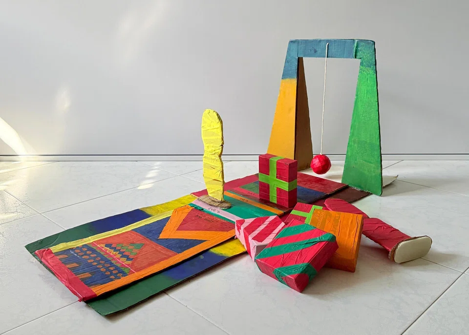 Tye Ming Xi, 11, created Wrecking Ball, where patients stand behind a table and swing a ball to knock over as many objects as possible.