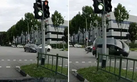 Car skids and flips after another car runs red light at Yishun junction, woman taken to hospital