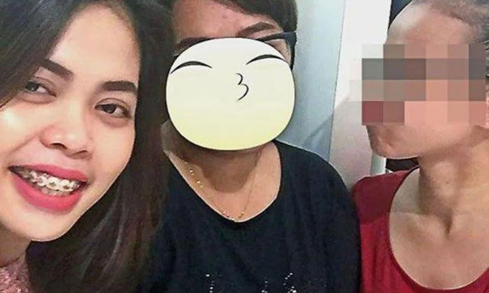 Cheerful and carefree: Siti Aisyah (left) posing with friends the night before the assassination. Photo: China Press