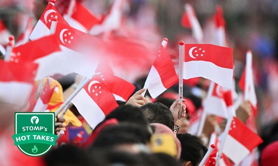 People waving flags at NDP 2025