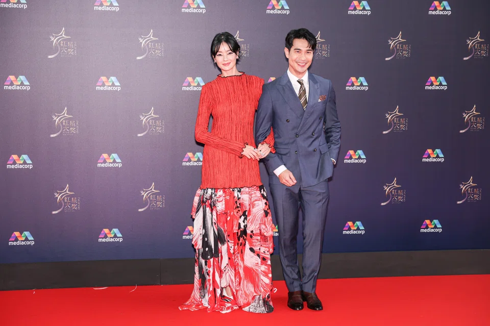 (From left) Actress Sheila Sim and actor Pierre Png on the red carpet at the Star Awards at Mediacorp on April 19. 