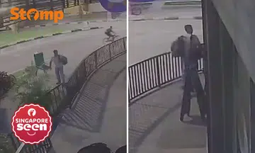 man takes bag from outside Jalan Besar eatery