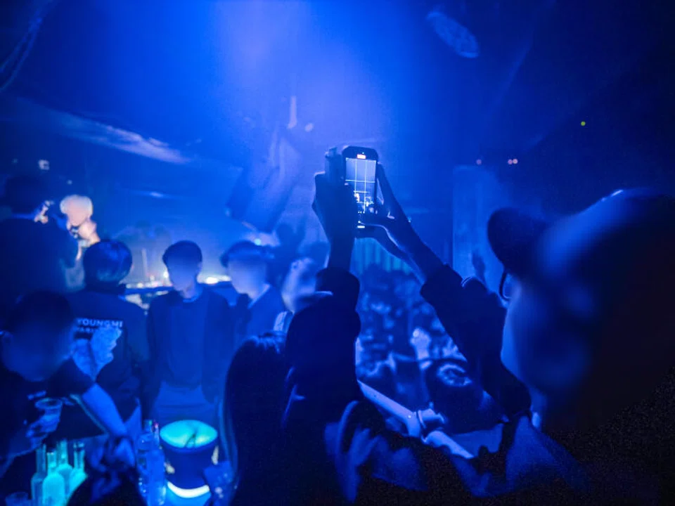  A man holding a vape in Drip club on July 19