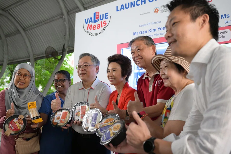 Deputy Prime Minister Gan Kim Yong (third from left) and Senior Minister of State Low Yen Ling (fourth from left) at the launch of the Value Meals @ South West initiative.