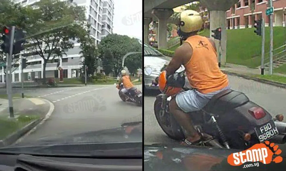 Errant motorcyclist makes left turn despite red light on Fajar Rd -- and ignores Stomper's honk