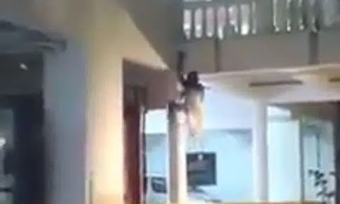 Video of woman in white crawling up pillar will give you chills