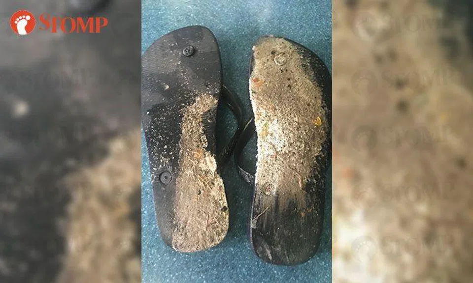 Pedestrian's slippers ruined after stepping on wet paint at Toa Payoh traffic junction