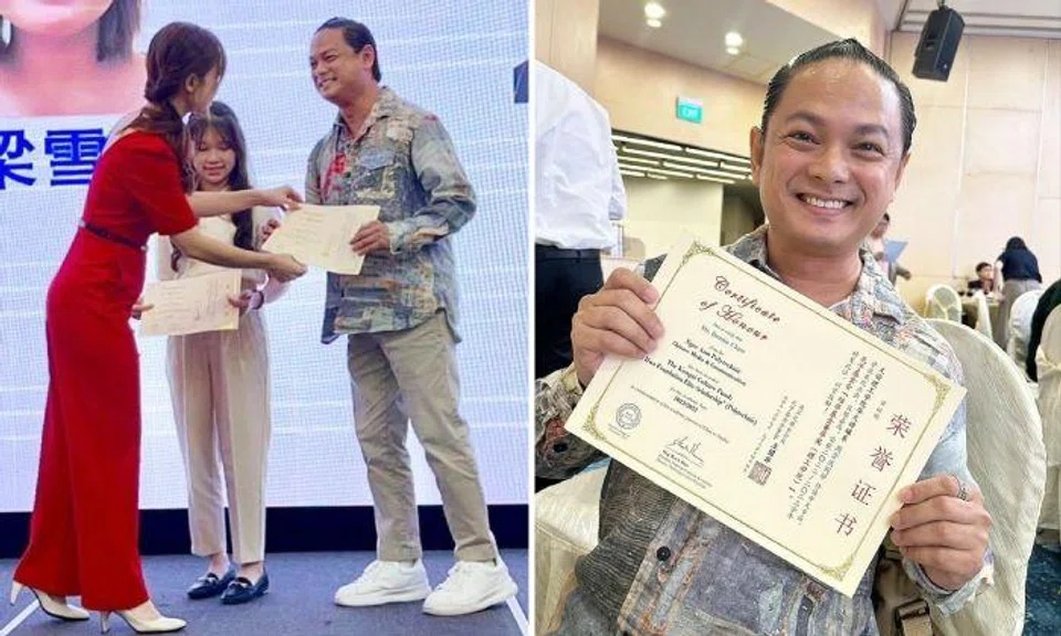 Dennis Chew received the certificate from Member of Parliament Tin Pei Ling.