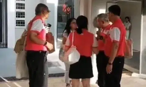 One of the videos released by Mr Azman Ibrahim shows a group of PSP members standing in a circle speaking to an unidentified female PAP volunteer.