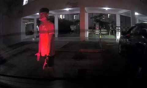 Man stands at loading bay in Sengkang and refuses to move even as driver tries to reverse into it