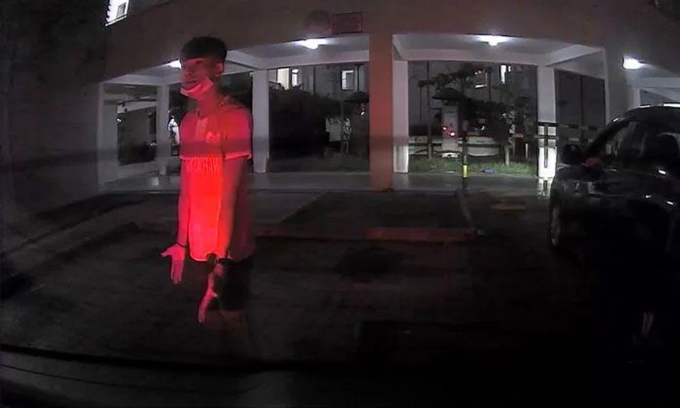 Man stands at loading bay in Sengkang and refuses to move even as driver tries to reverse into it