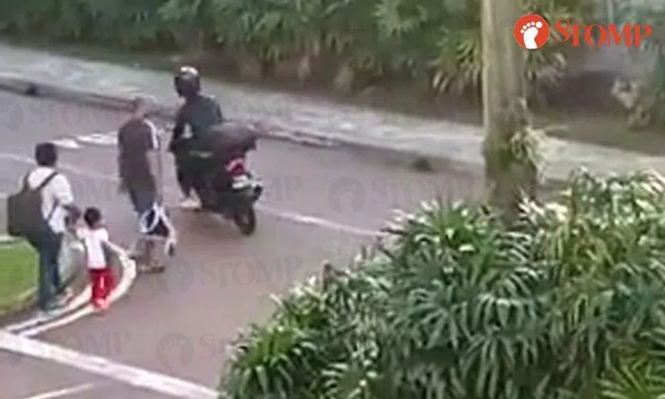Impatient woman rides motorcycle past family with toddler instead of letting them pass