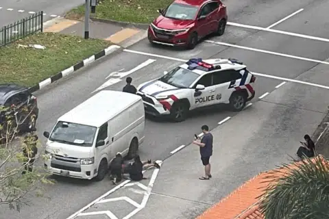 Boy, 8, dashing across road gets hit by van, trapped underneath