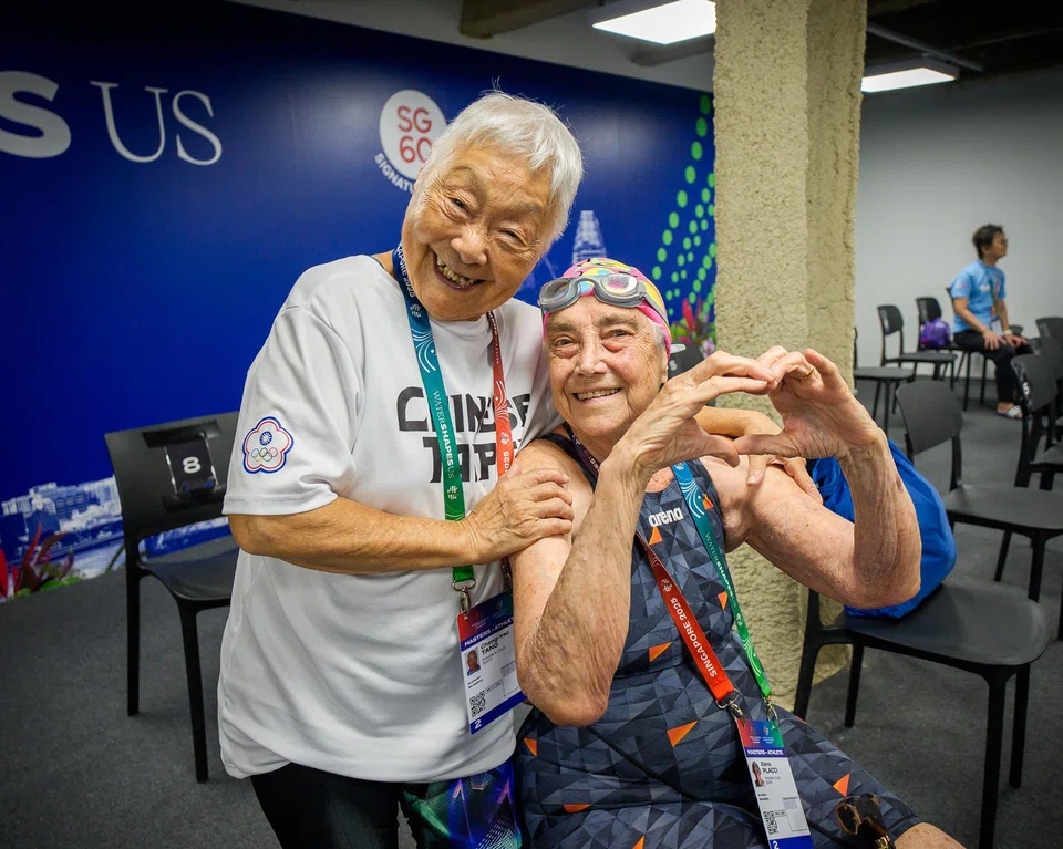 Tang Cheng-Yao (left), 96, is the oldest female participant at the World Aquatics Masters competition in Singapore. On her right is Argentina swimmer Elena Placci, 90. 