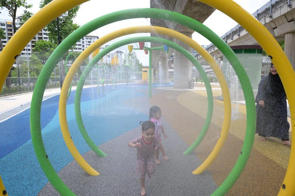 Children at the Yew Tee Lifestyle Corridor’s water play plaza on March 28.