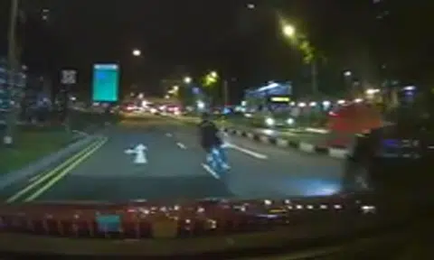 Cyclist riding in middle of the road is lucky to be alive after near-accident with car