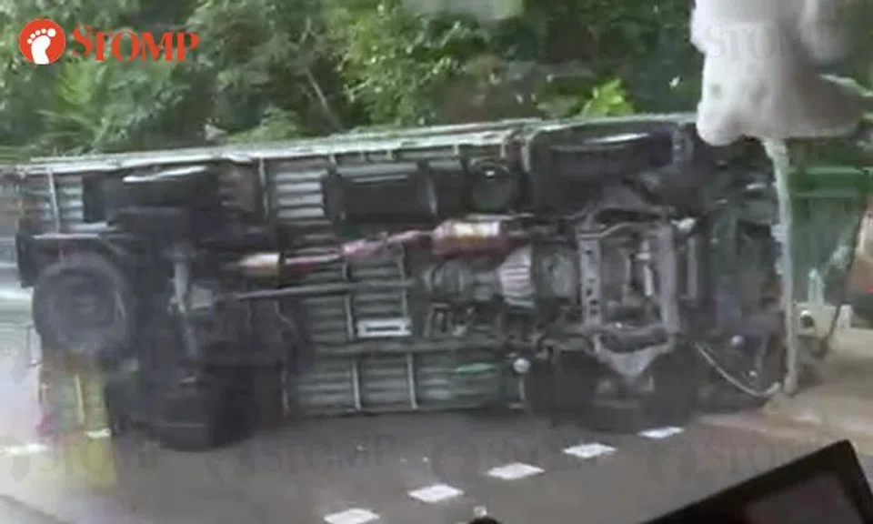 7 passengers taken to hospital, driver arrested after lorry overturns along Tuas West Road