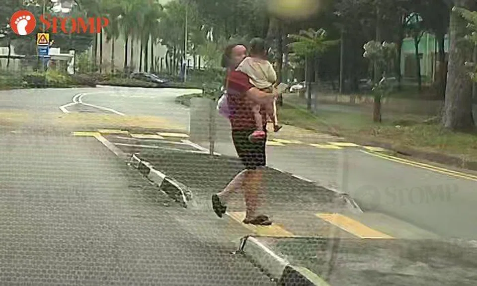 'Ridiculous' of woman to cross road so recklessly with child in her arms