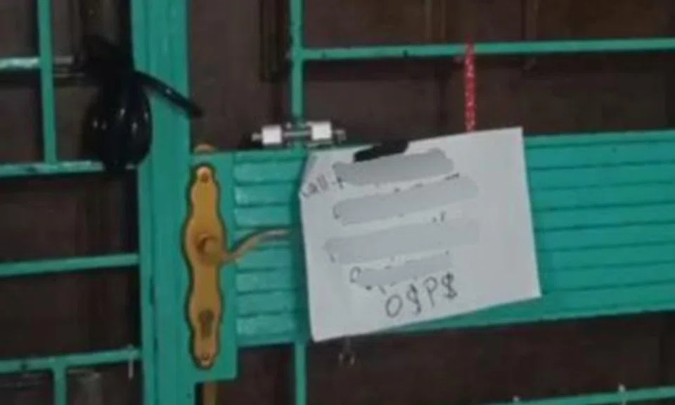 Woman, 29, arrested for locking Bukit Panjang flat's gate and leaving note: 'O$P$'