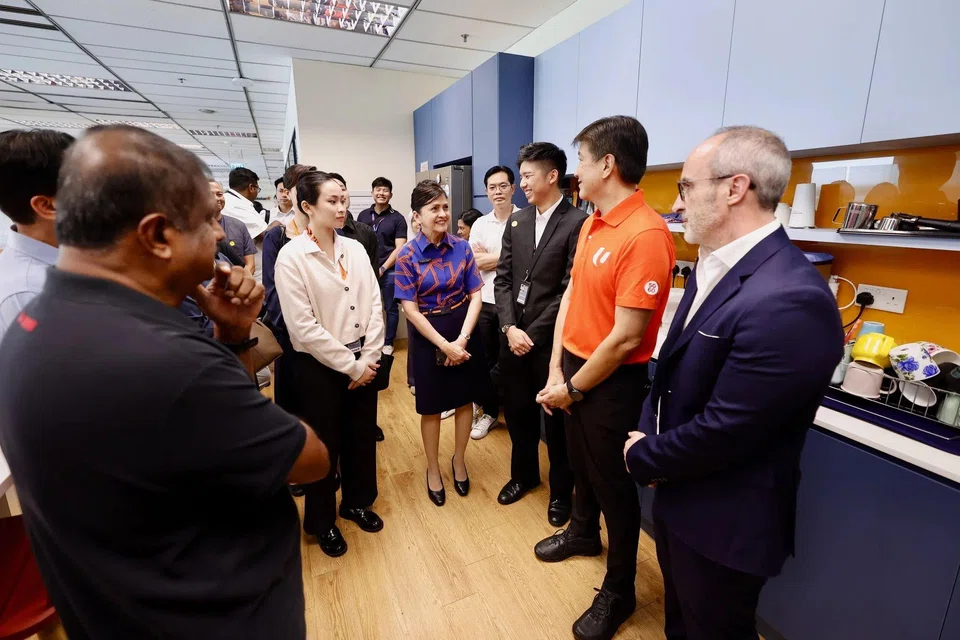 Labour chief Ng Chee Meng (second from right) meeting Jetstar Asia workers on June 18.
