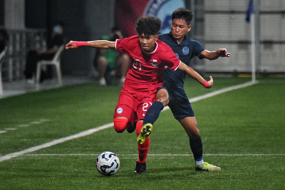 Singapore's Ahmad Izzan Rifqi vying for the ball with Cambodia's Sanh Sokchea in a Lion City Cup Under-16 boys' match at the Jalan Besar Stadium on July 11.