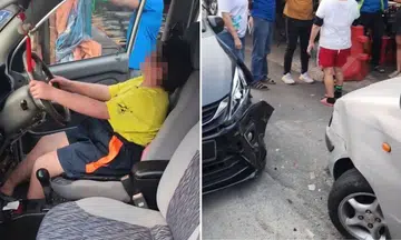 girls slumps over driver’s seat after crashing car in Malaysia