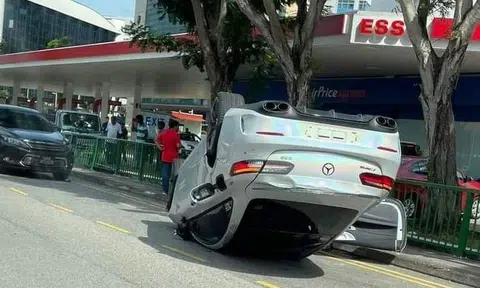 A Mercedes-Benz overturned after an accident involving three cars, lorry and cyclist at MacPherson Road on Saturday (Feb 18).