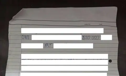 Note left at Haig Road flat says resident owes $20,000