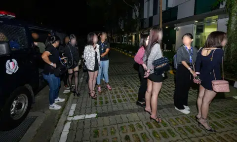 Suspects being taken into custody during an enforcement operation at two public entertainment outlets on Oct 23, 2025.