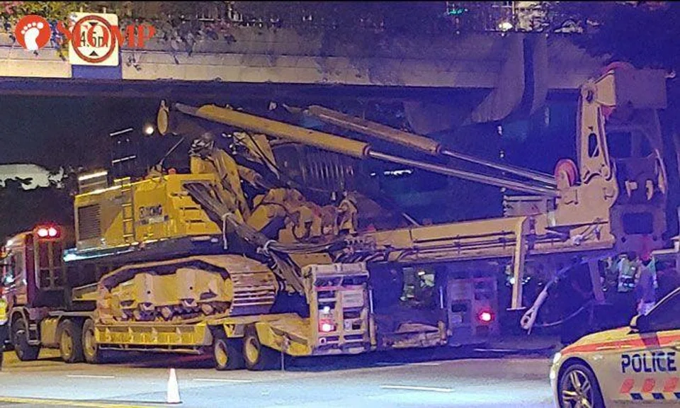 Crane crashes into overhead bridge at Jurong Town Hall Road