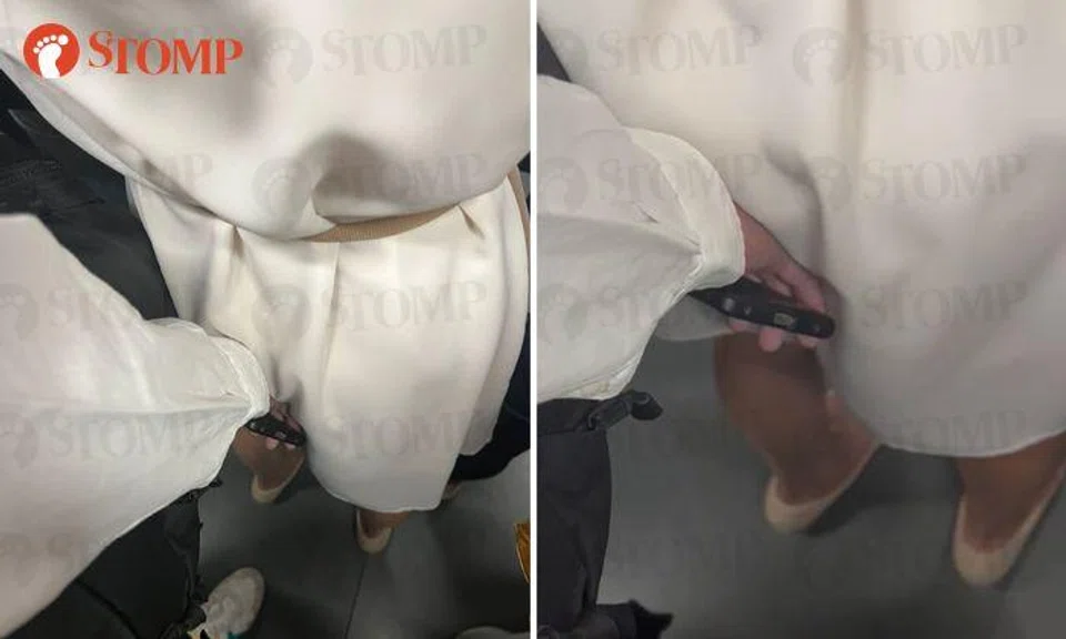 Man places hand against woman's backside even as she tries to move away on MRT