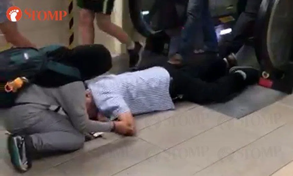 Man lies in pool of blood after tripping on escalator at Bishan MRT Station