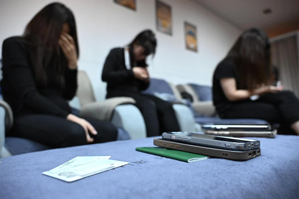 Phones, passports and work documents were seized from workers at a massage parlour in People’s Park Centre. ST PHOTO: CHONG JUN LIANG